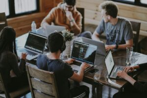 RH group of people using laptop computer